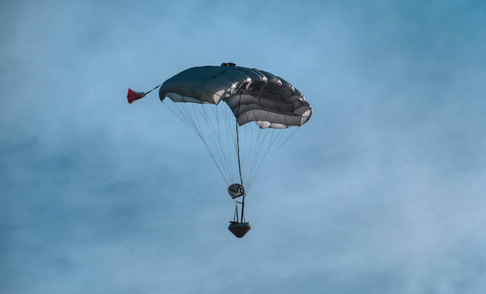 SpaceWorks RED capsule descends under parafoil